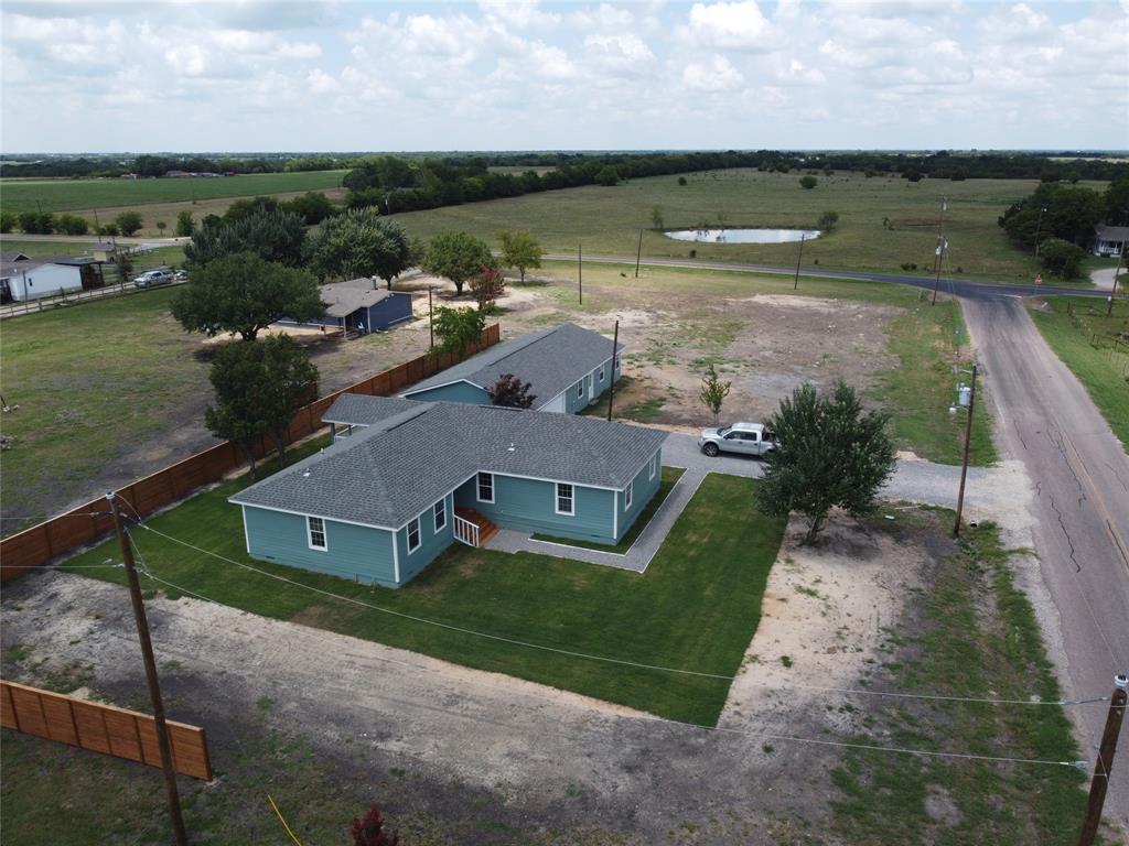 an aerial view of a house with a lake view