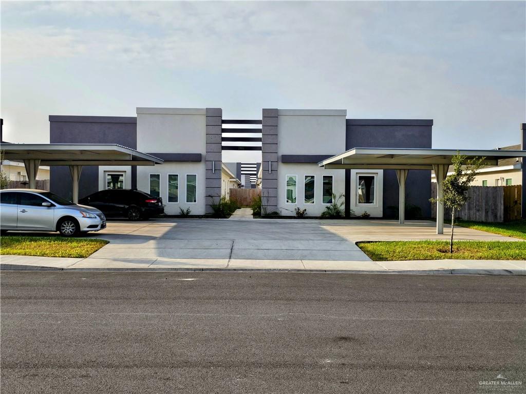 Contemporary house featuring a carport