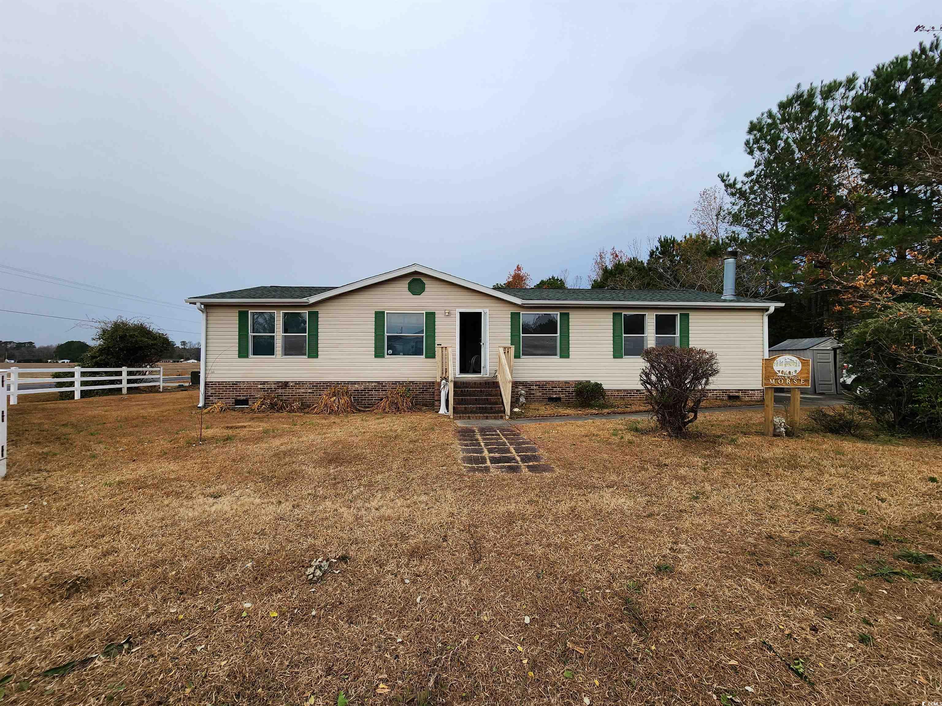 View of front facade with a front lawn