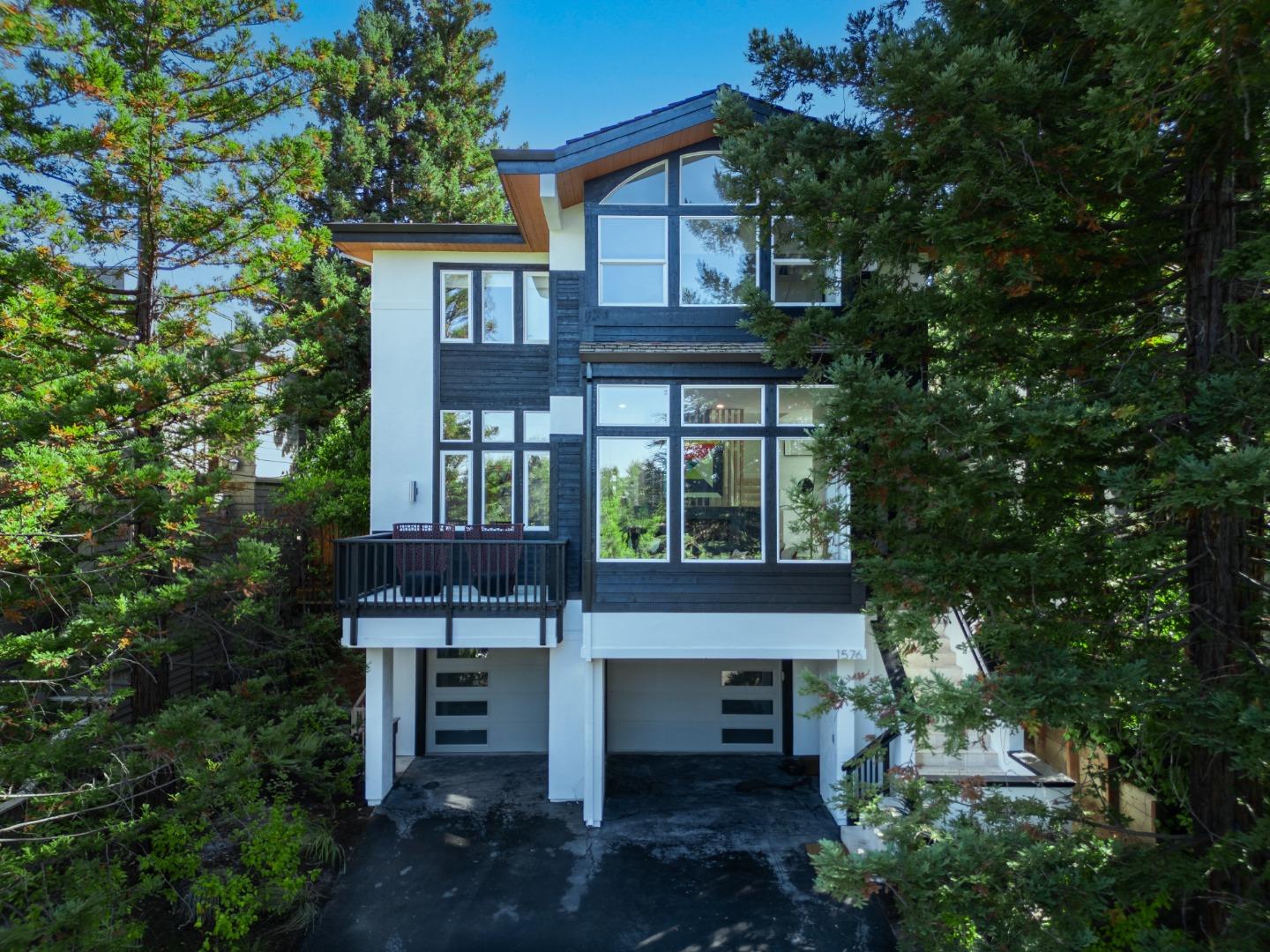 front view of a house with a tree