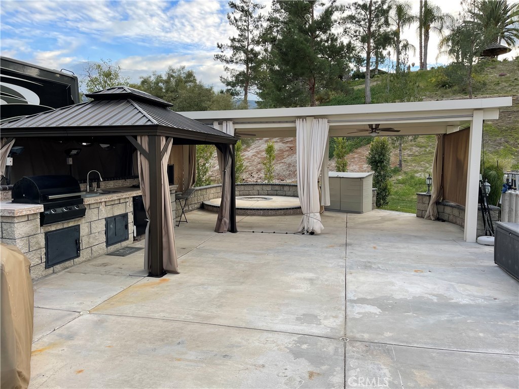 a view of house with backyard and outdoor seating