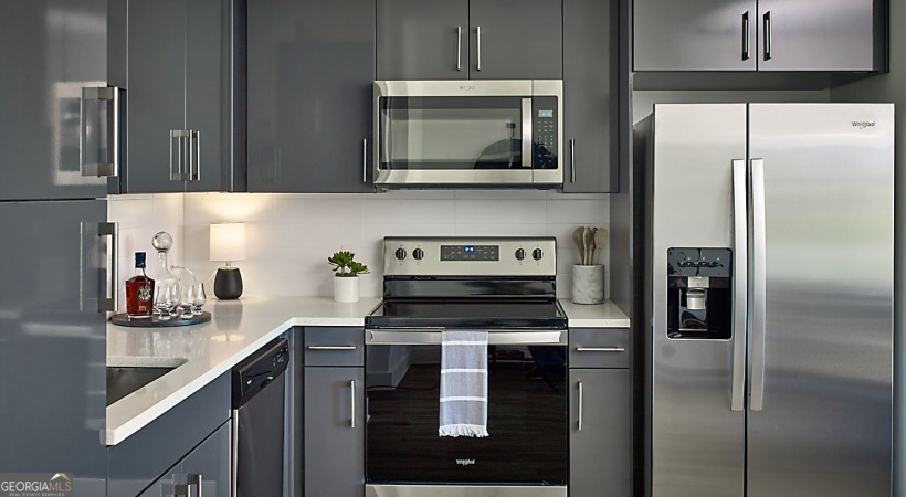 a kitchen with a refrigerator sink and microwave