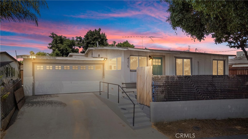 a view of a house with a garage