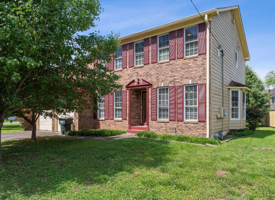 front view of a house with a yard