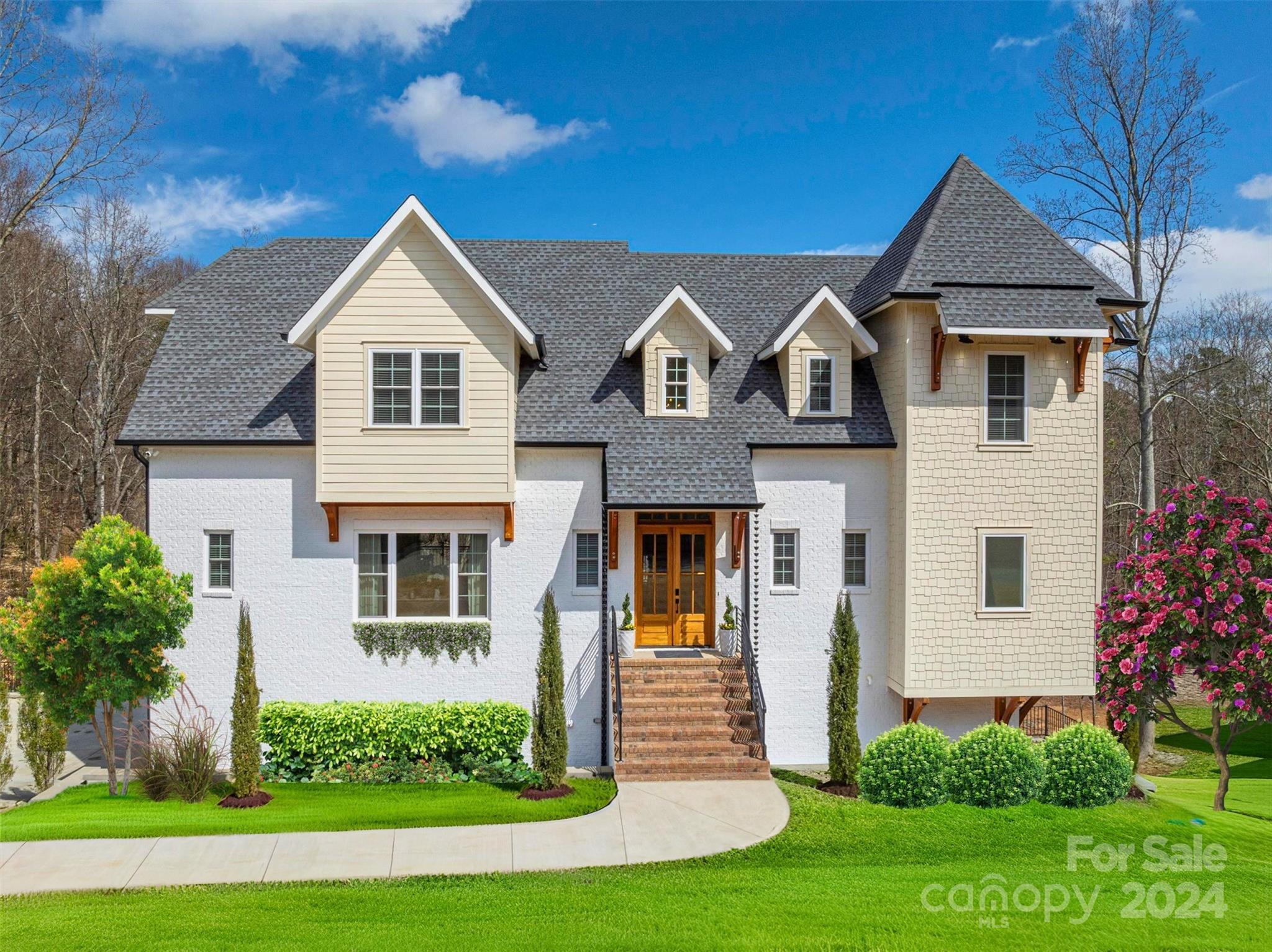 a front view of a house with a yard