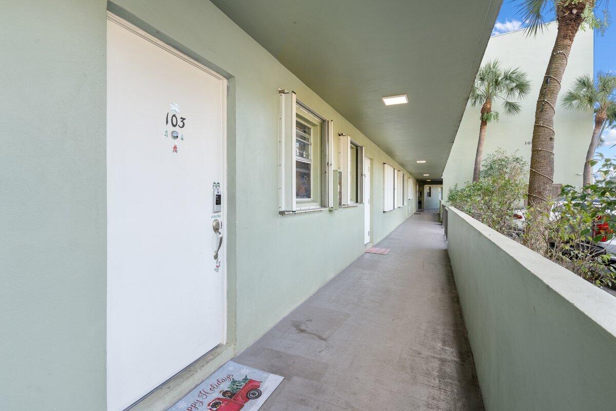 a view of a hallway with windows