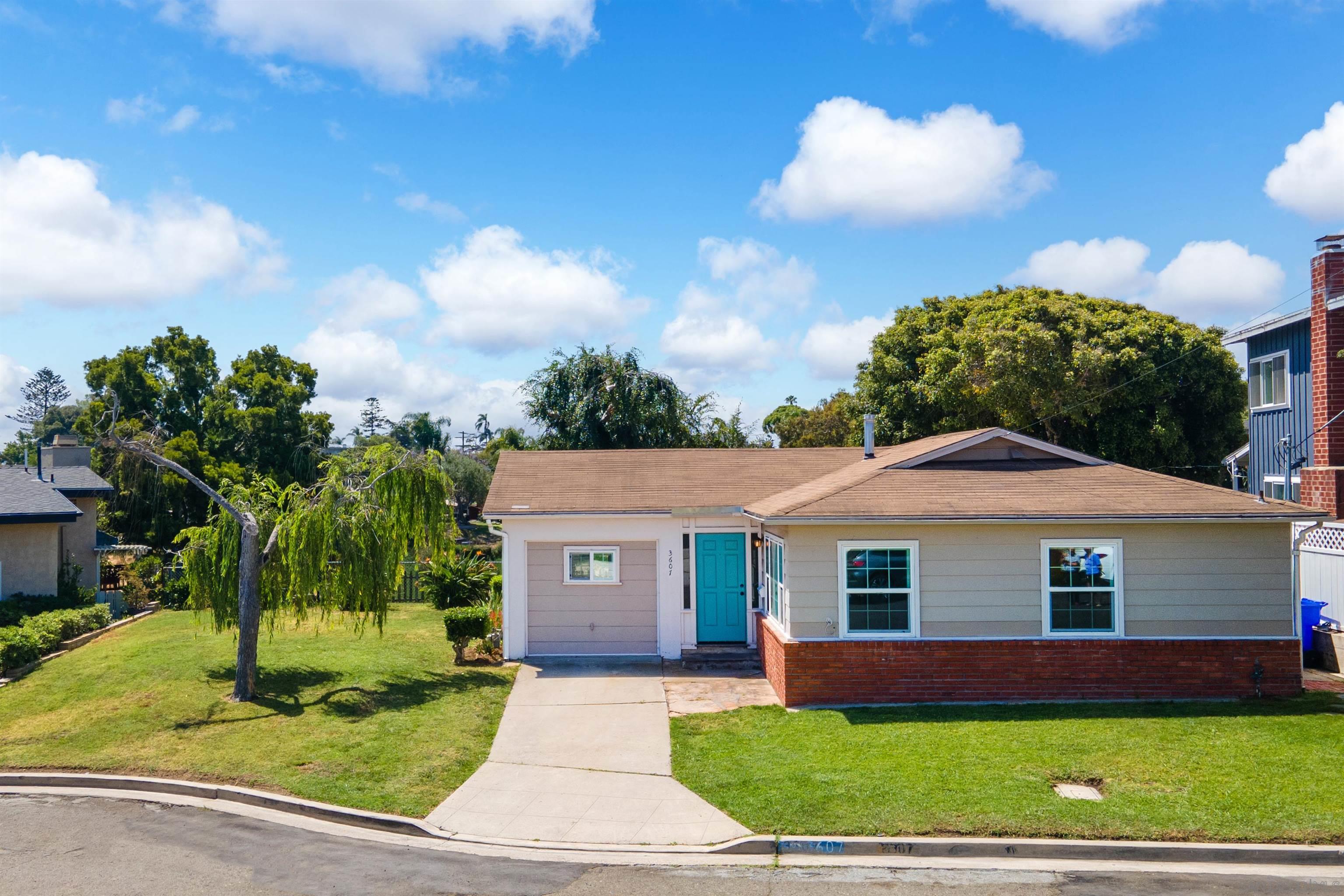 a front view of a house with a yard