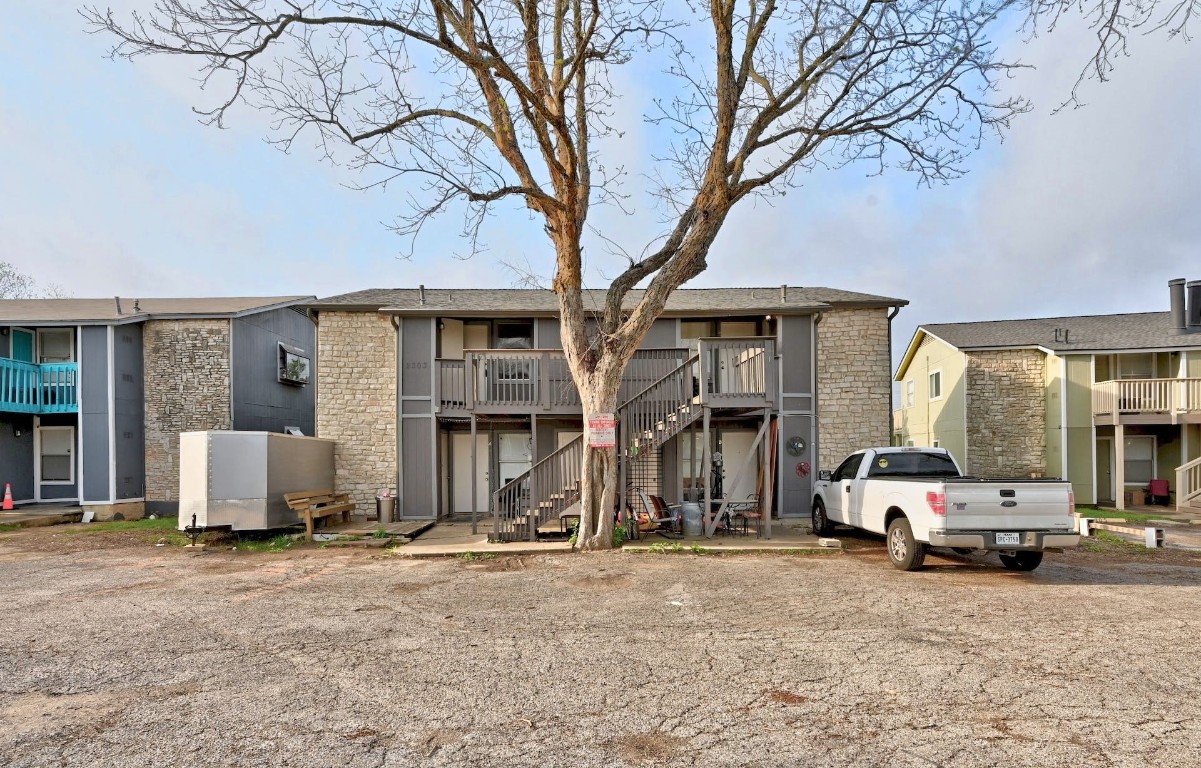 a house with a large tree in front of it