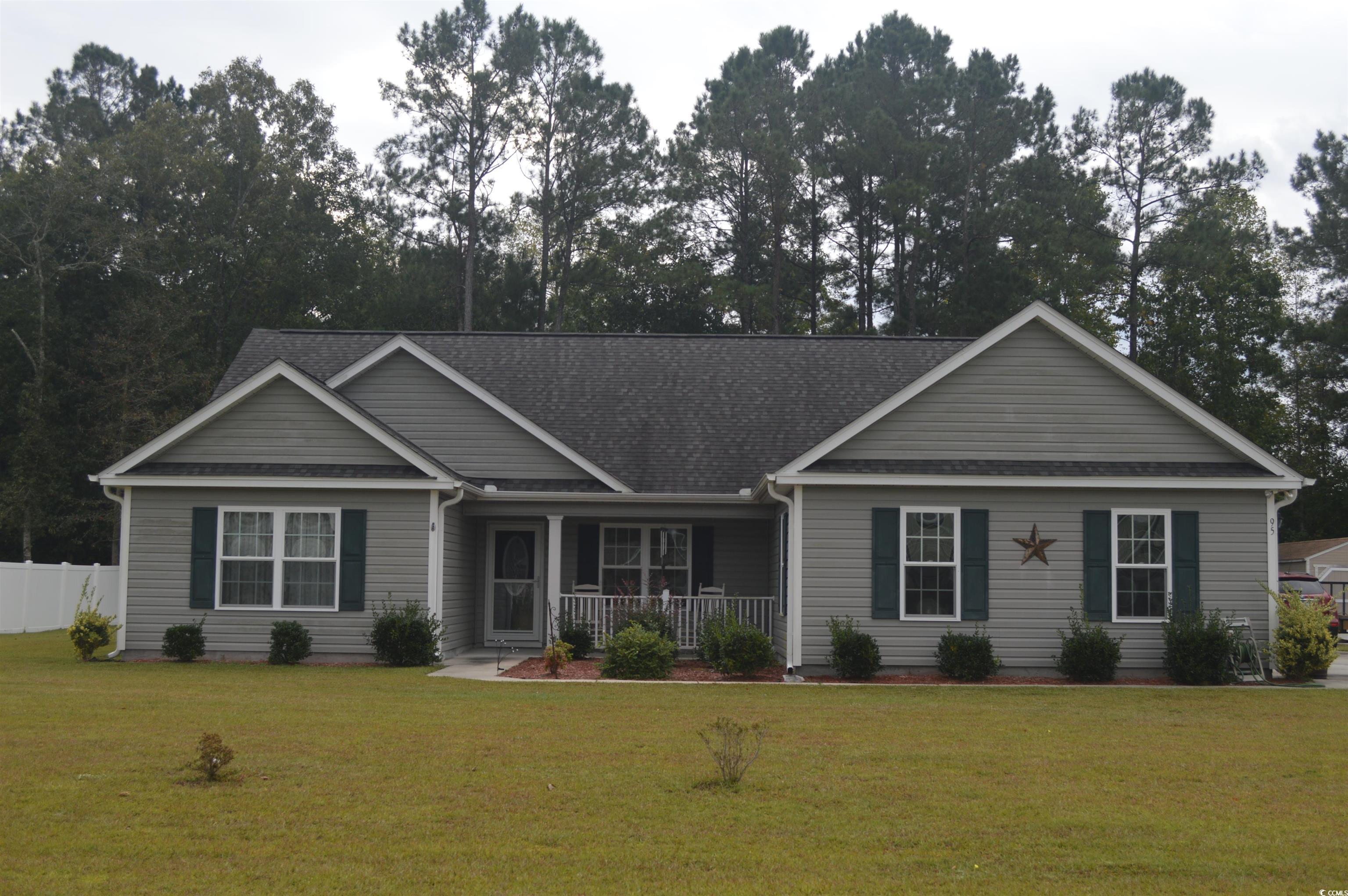 View of front facade featuring a front lawn and co