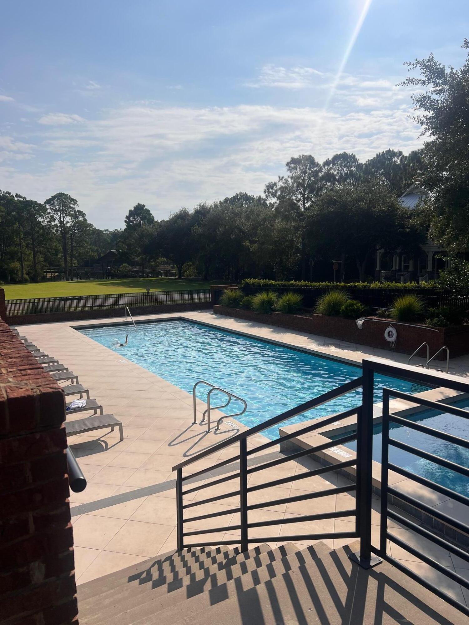 a view of swimming pool with lake and mountain view