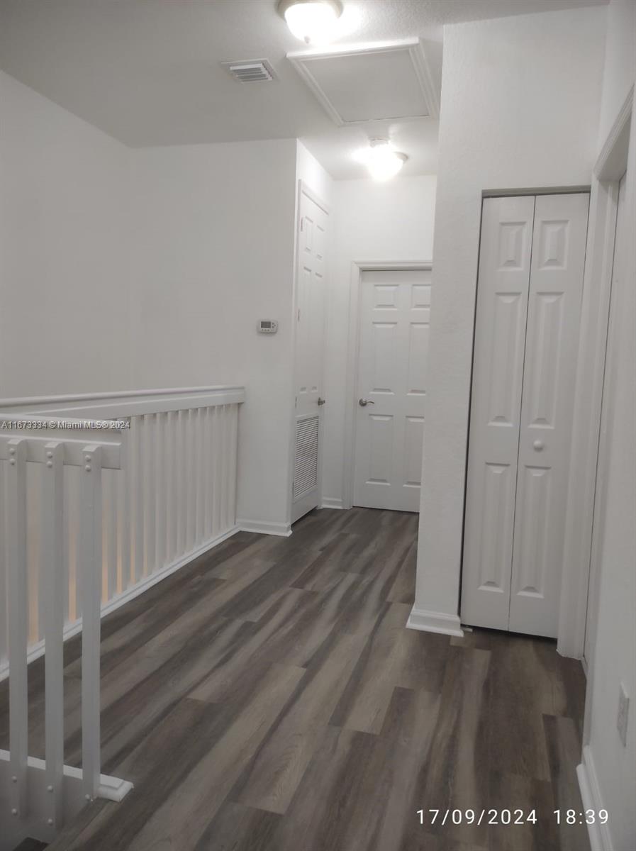 a view of entryway with wooden floor