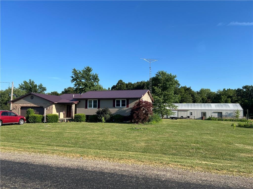 a view of a house with a big yard