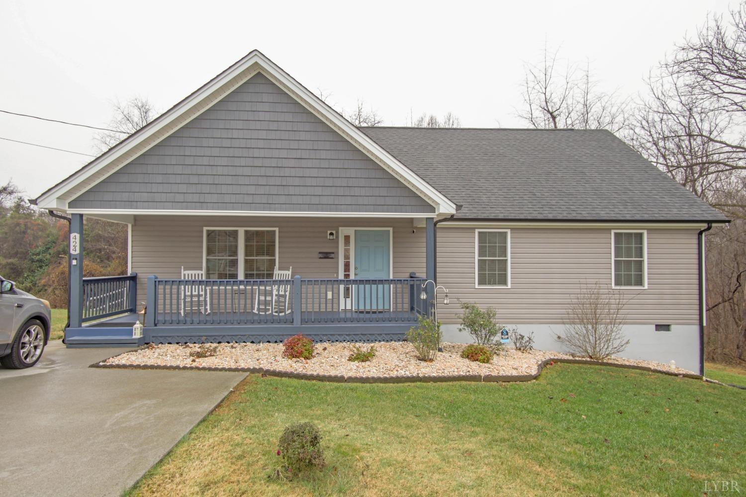 a view of a house with swimming pool and porch