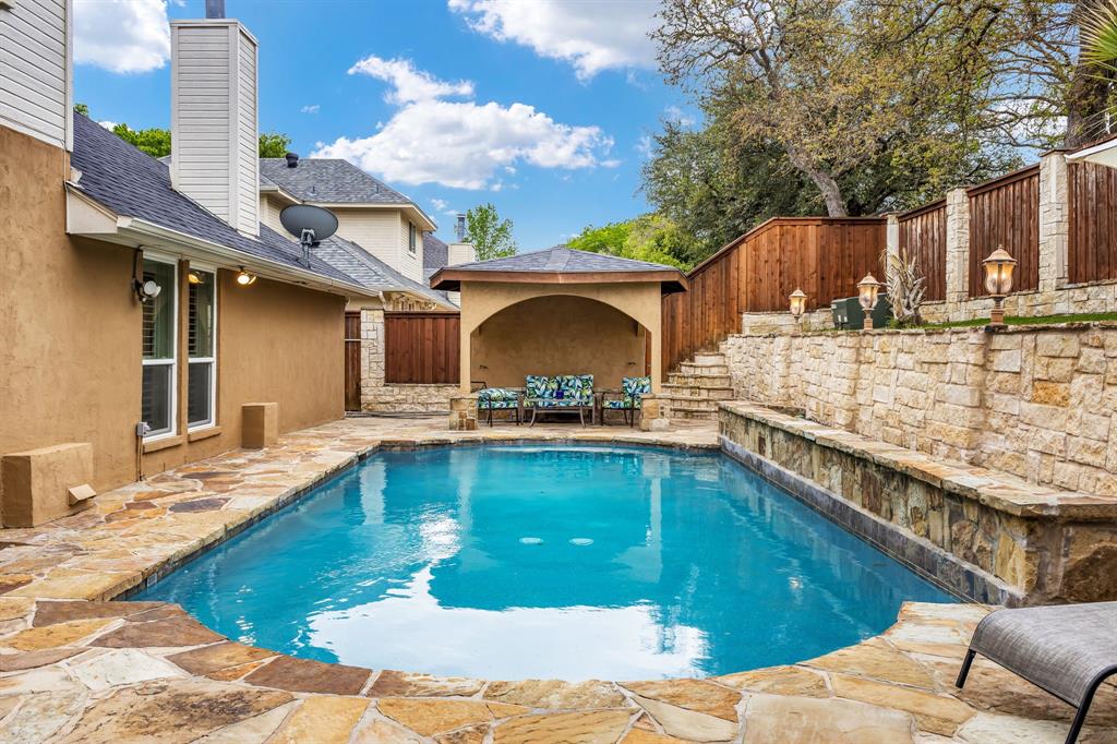 a view of a swimming pool with a patio