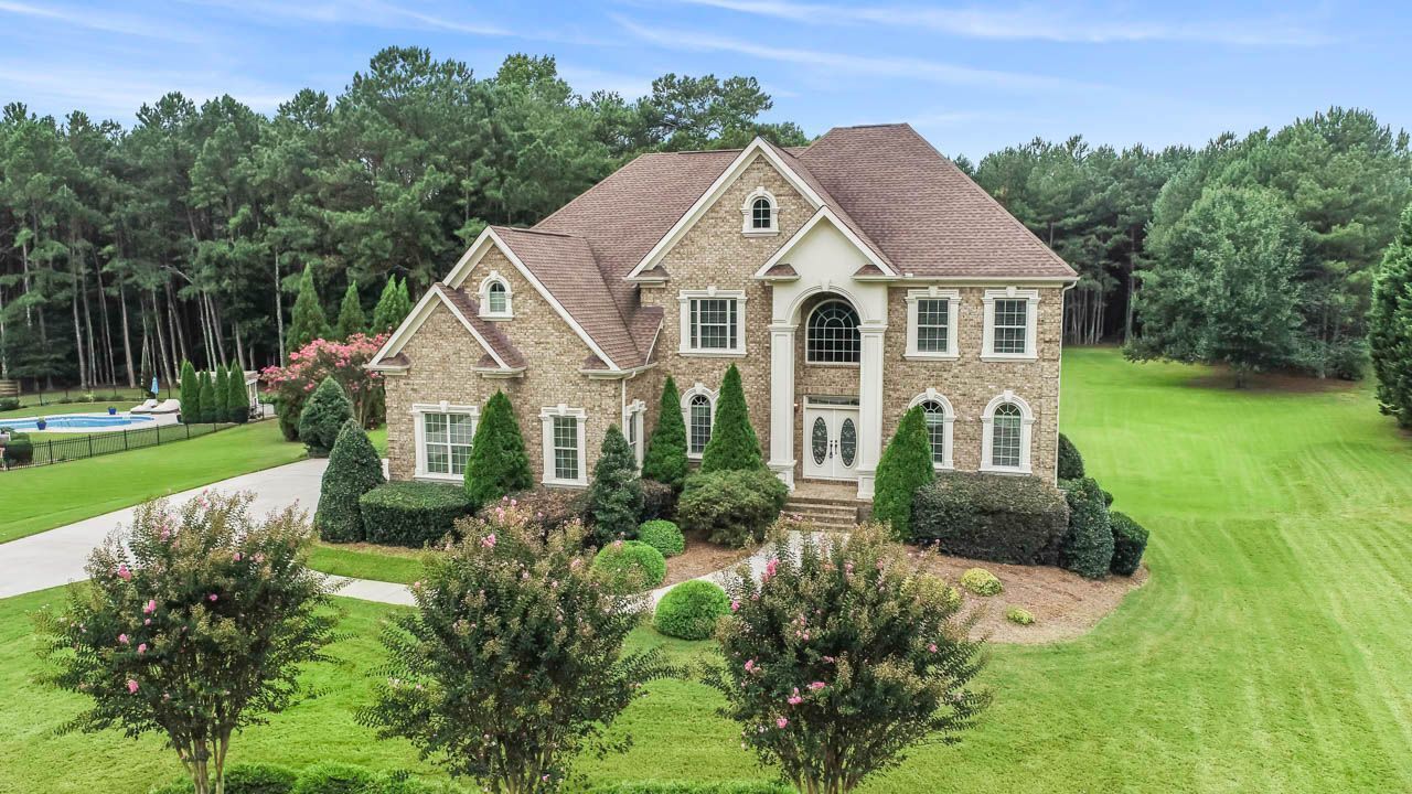 a front view of a house with garden