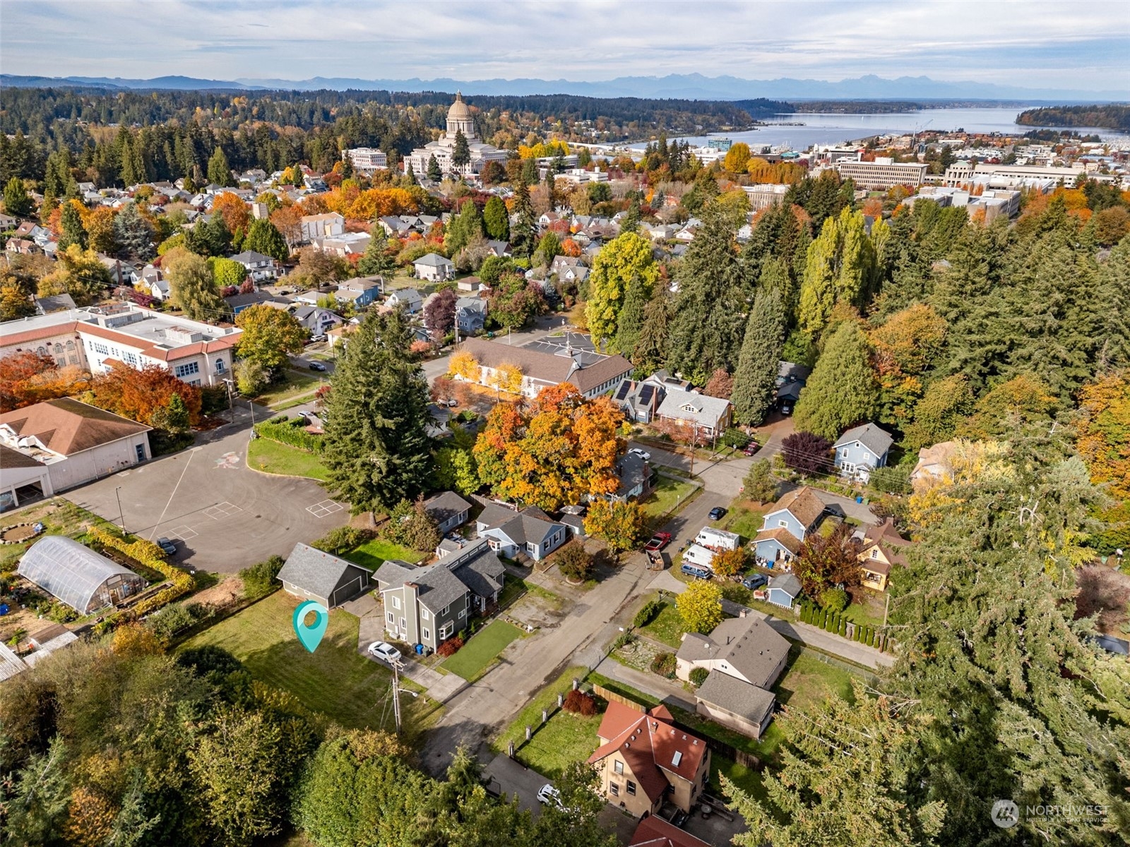 an aerial view of residential building and parking space