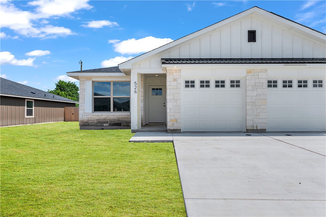 a front view of house with yard