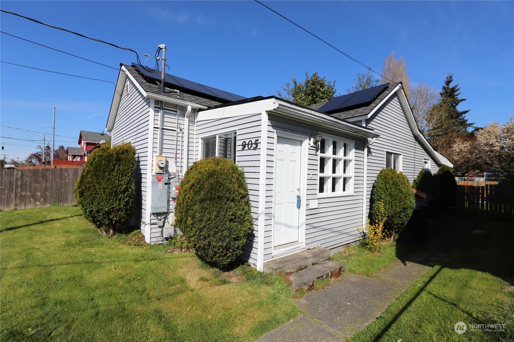 a view of a house with a yard and plants