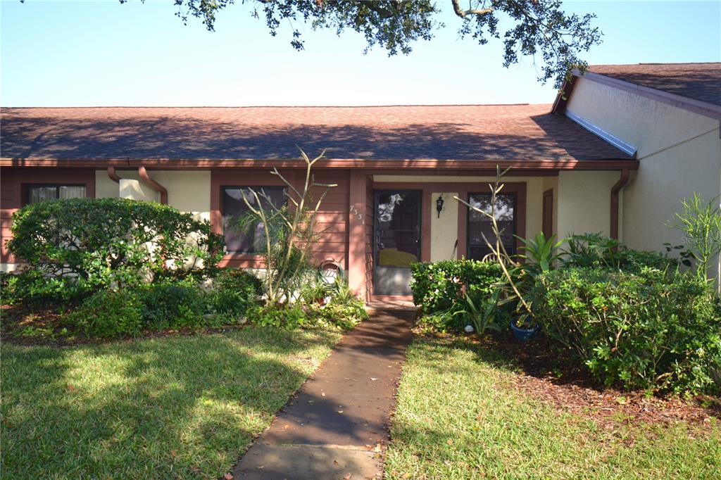 a view of a house with a yard