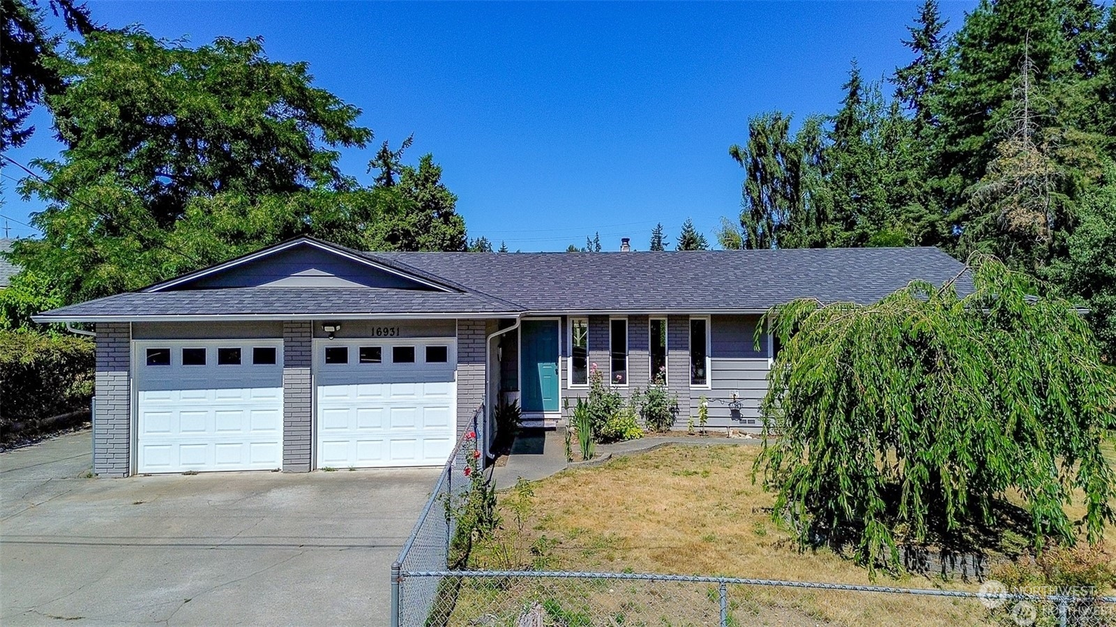 front view of a house with a yard