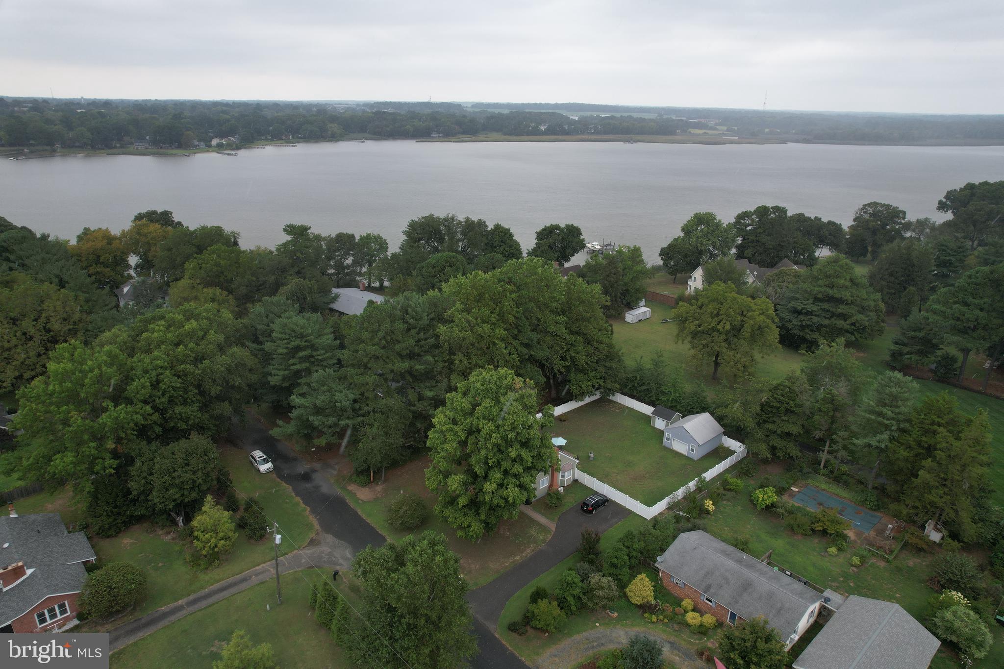 an aerial view of a house with lake view