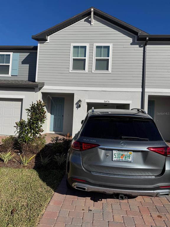 a car parked in front of a house