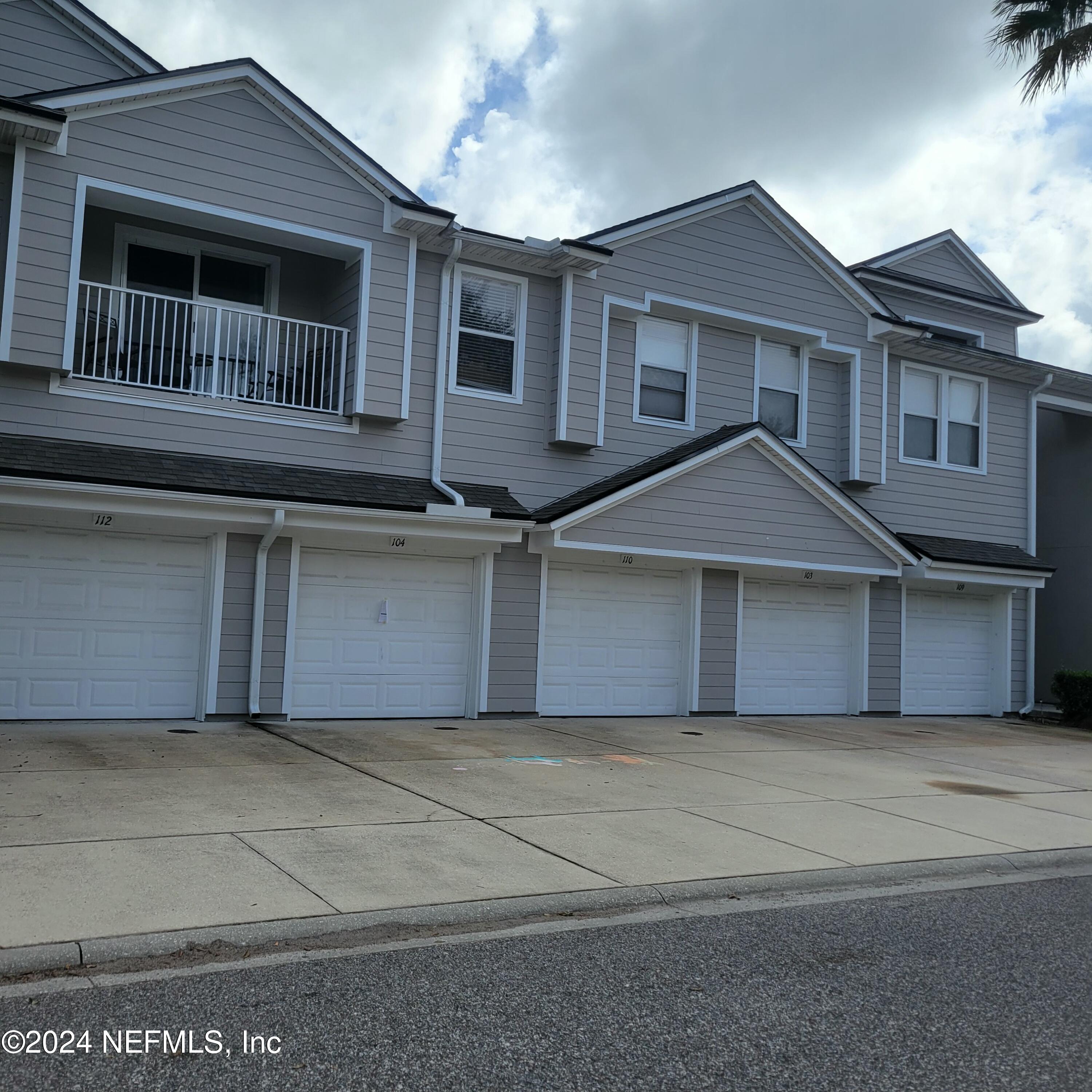 a front view of a house with a garage