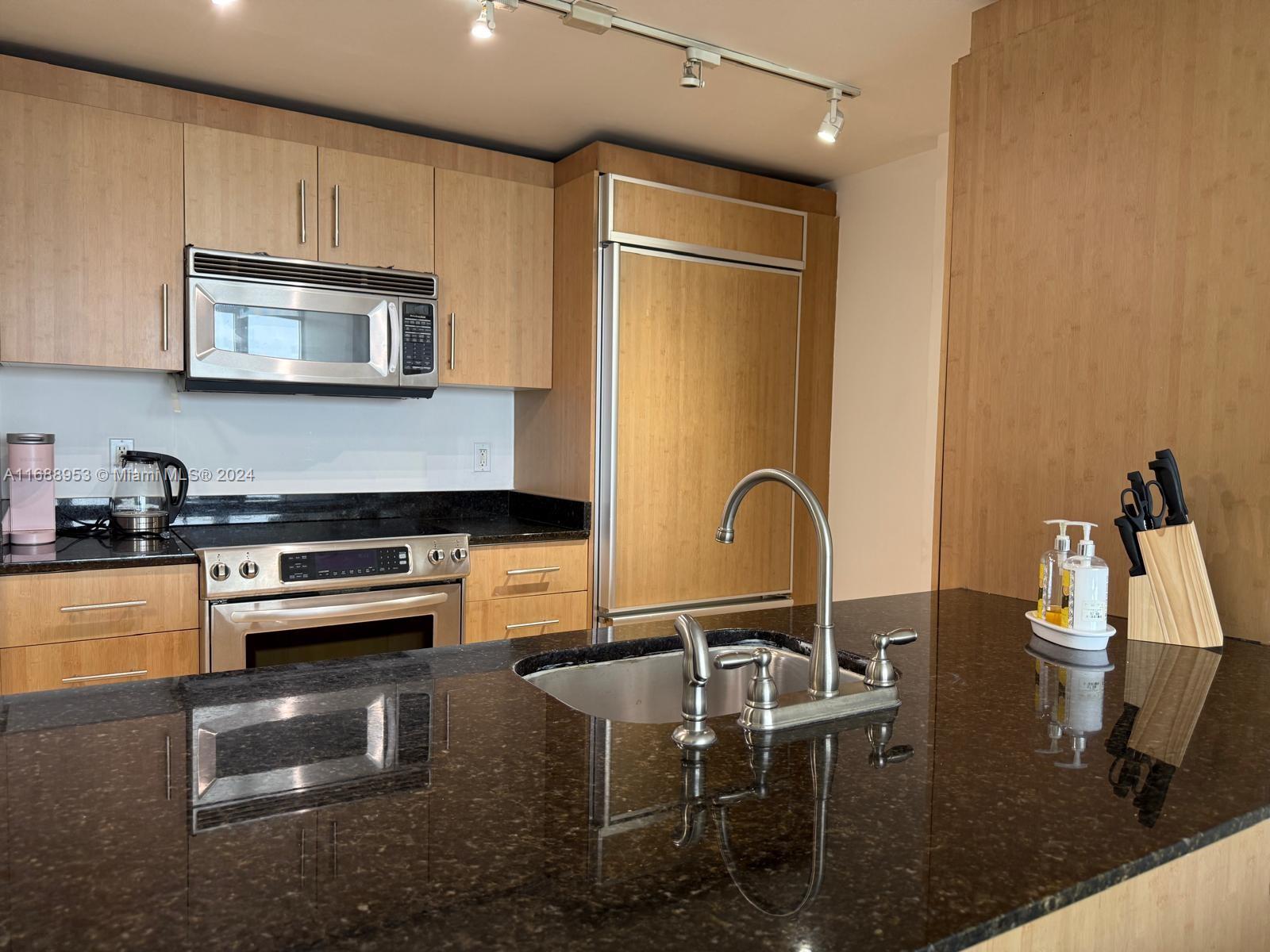 a kitchen with a table chairs and a stove