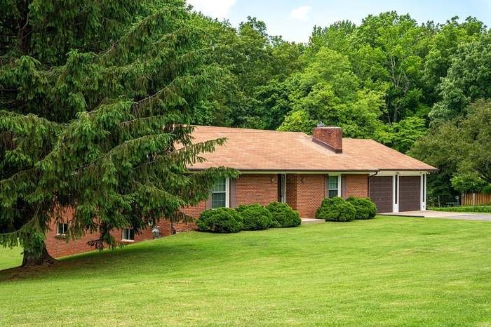 a backyard of a house with lots of green space