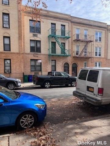 a view of a car parked in front of a building