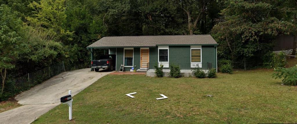 a view of a house with backyard porch and garden