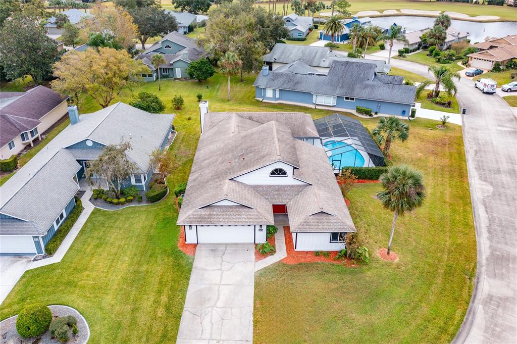 an aerial view of a house with swimming pool