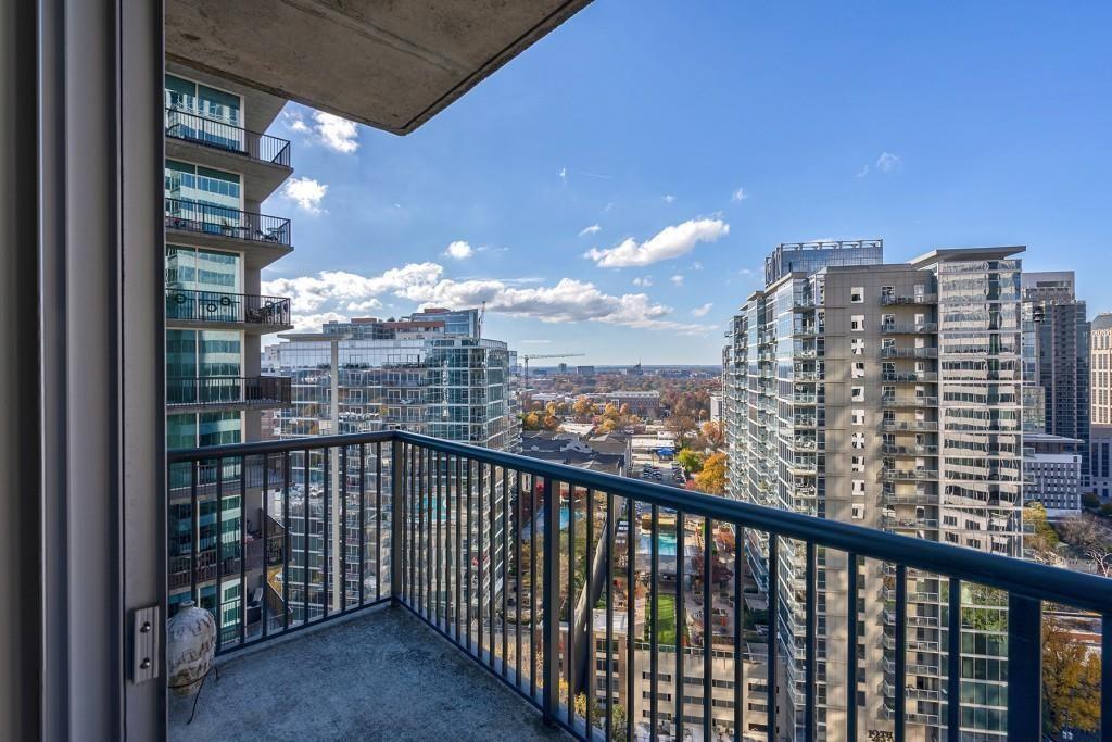 a view of a balcony with city view