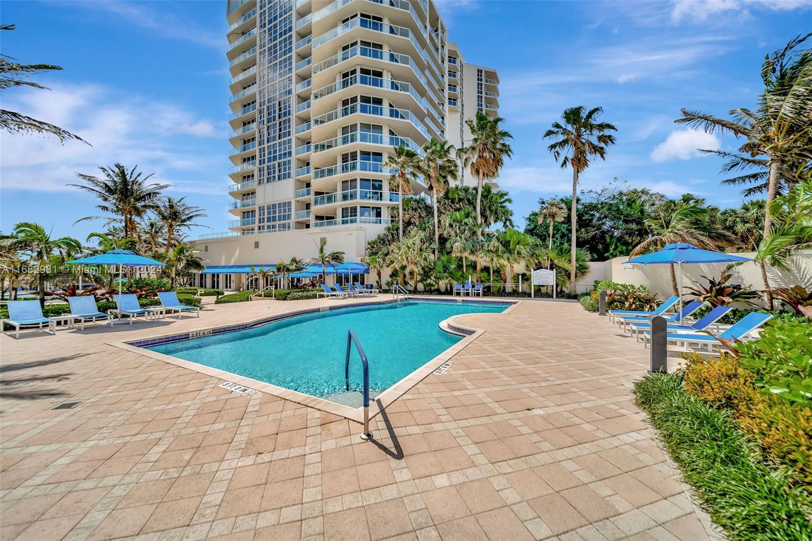 a view of a swimming pool and front of house