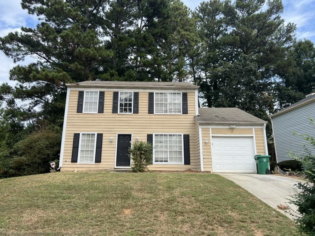 front view of a house with a yard