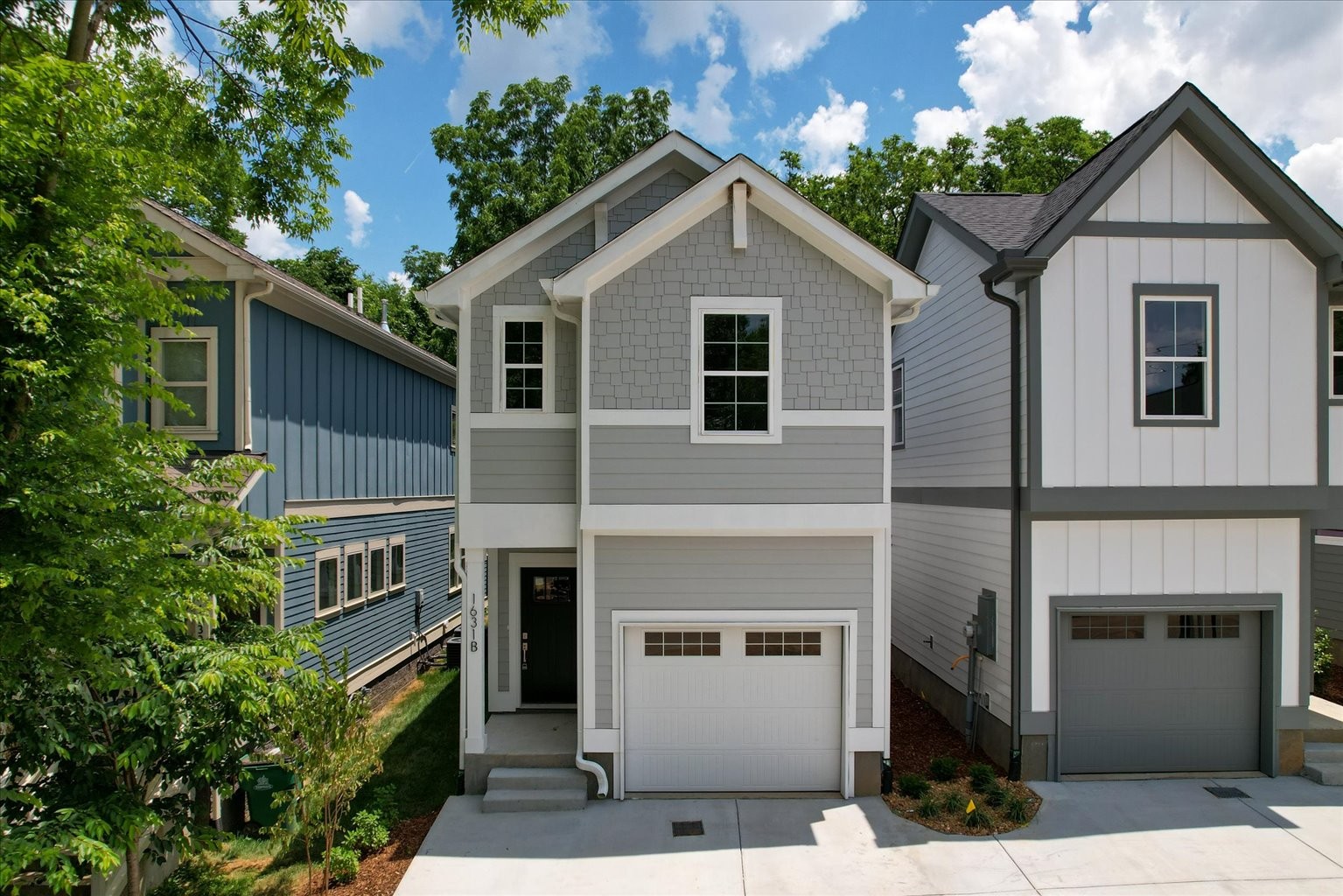 a front view of a house with a garage