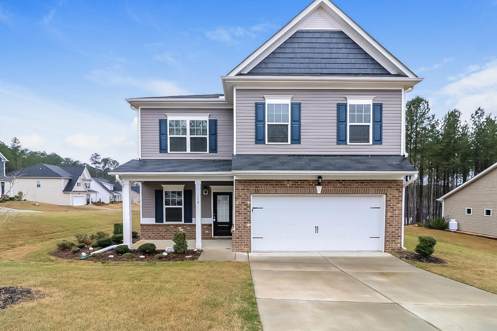 front view of a house with a yard