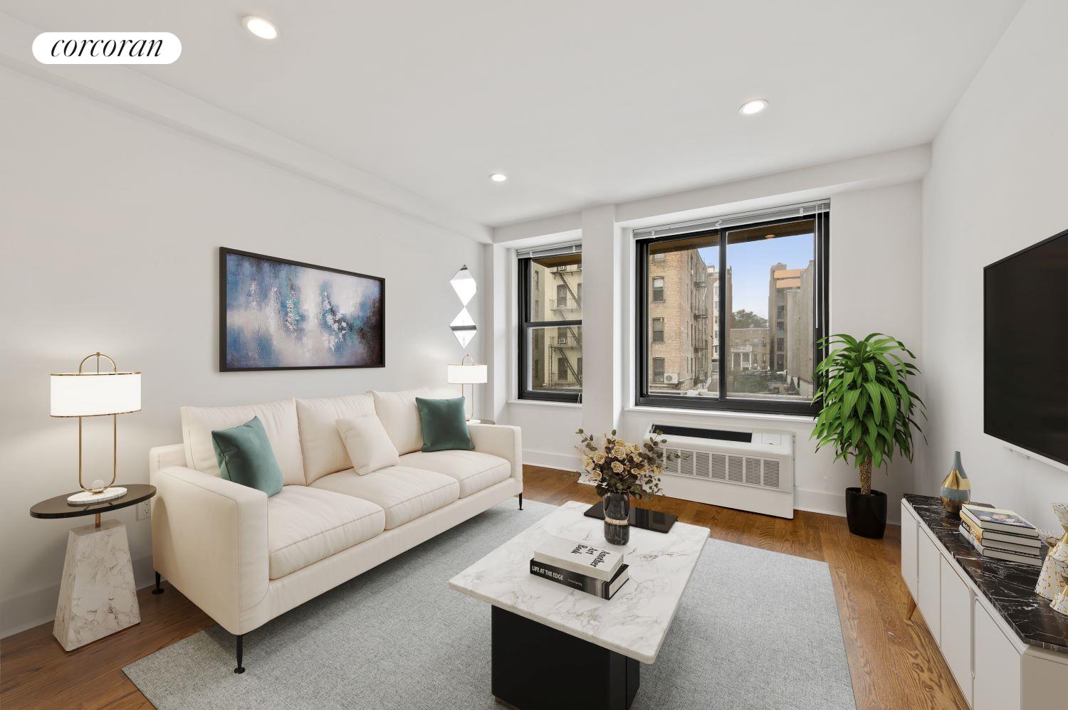 a living room with furniture potted plant and a flat screen tv