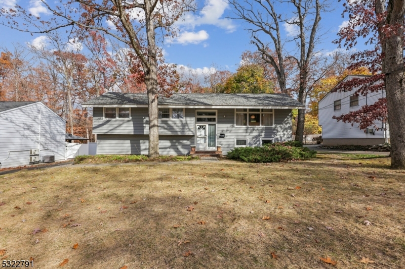 front view of house with an trees