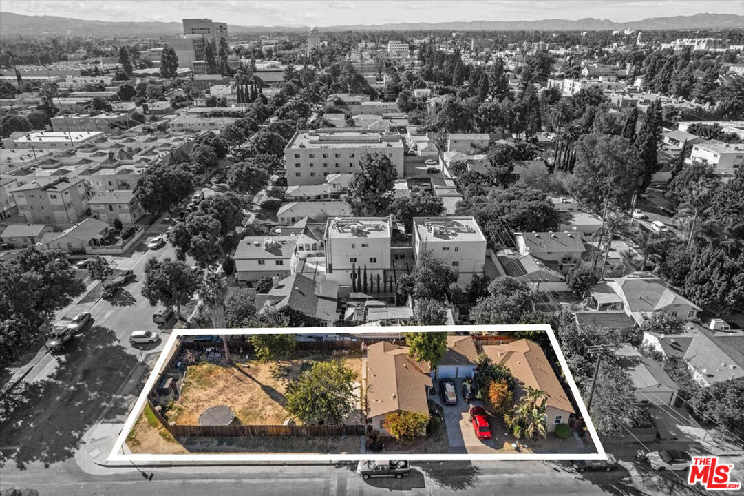 an aerial view of a house with a swimming pool