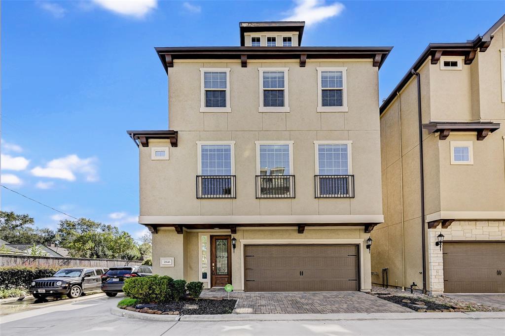 a front view of a house with parking