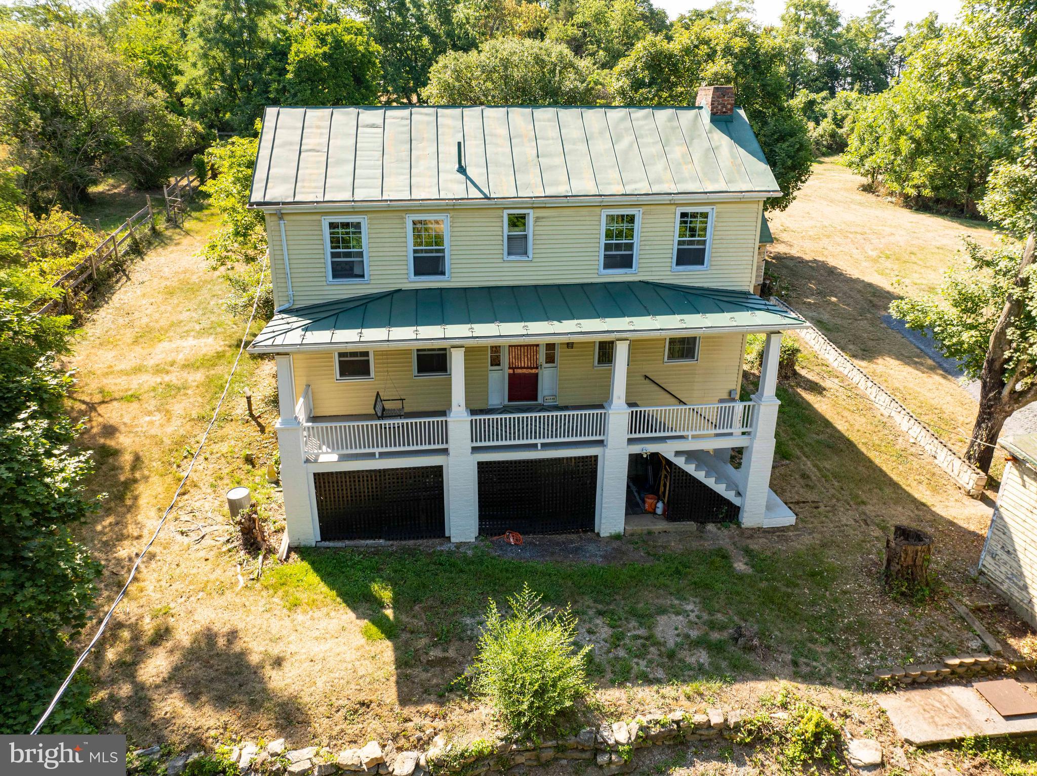 a view of house with a yard