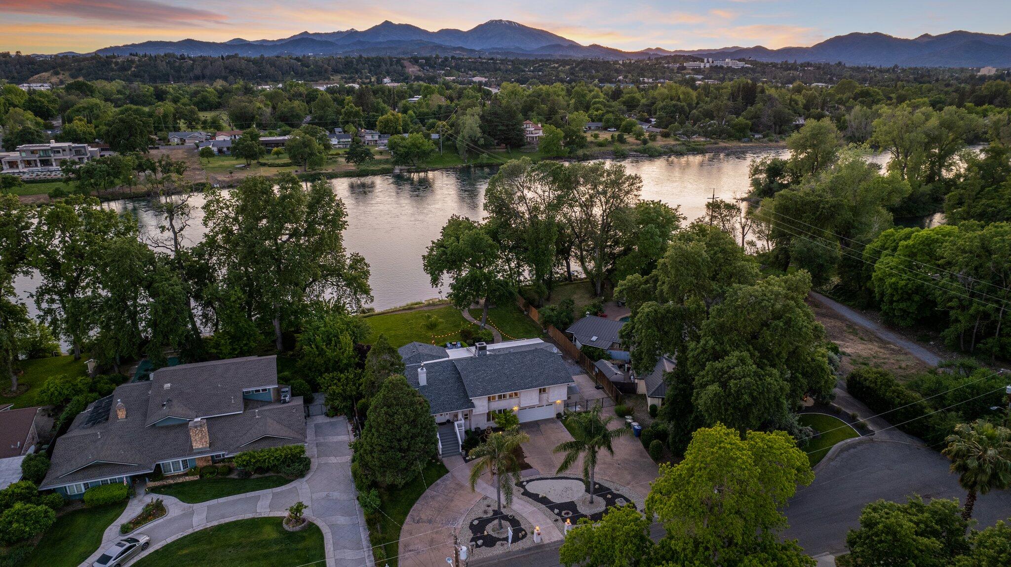 an aerial view of a house with a lake view