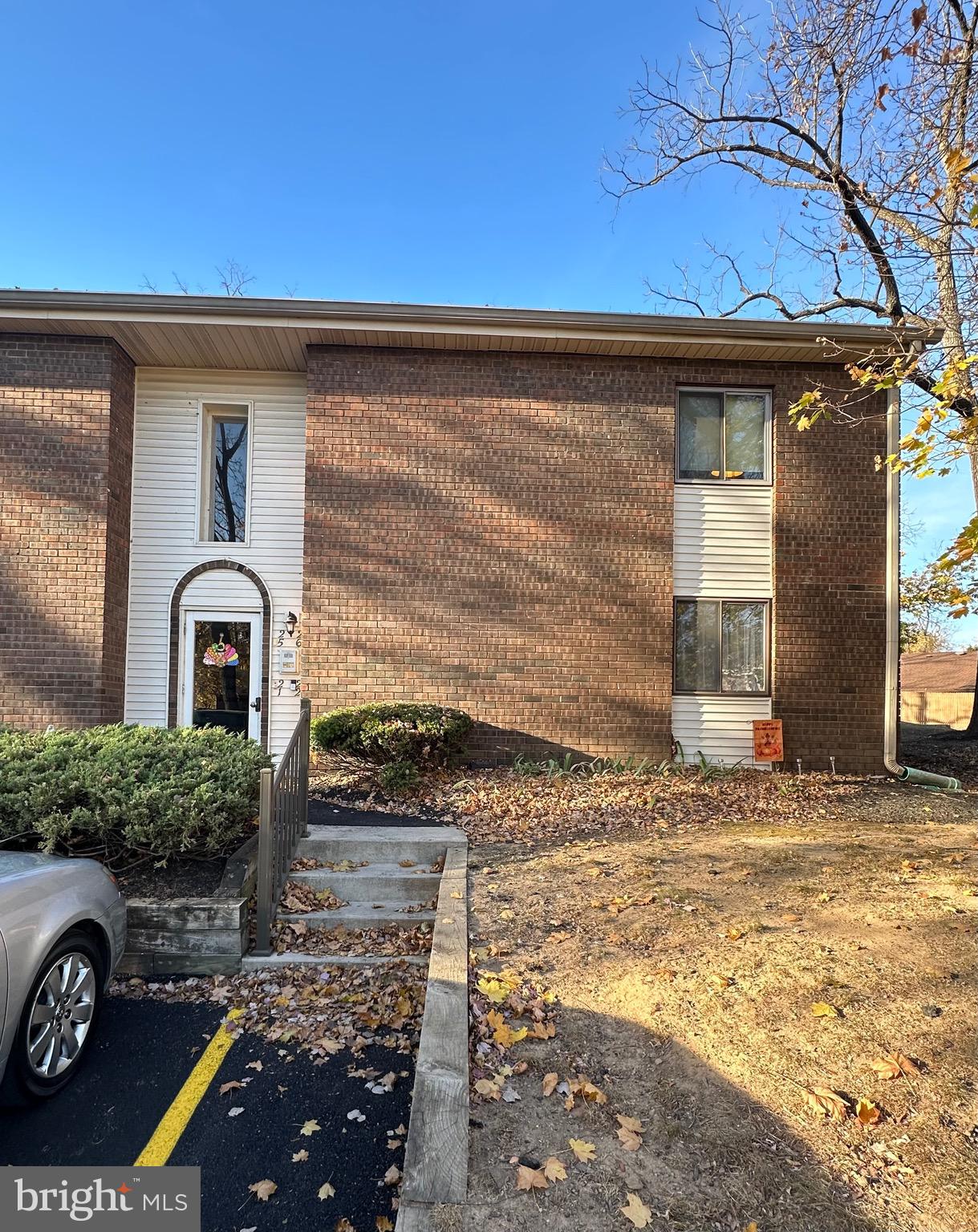 a front view of a house with parking area