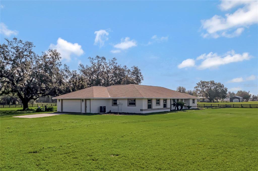 a view of a house with a big yard