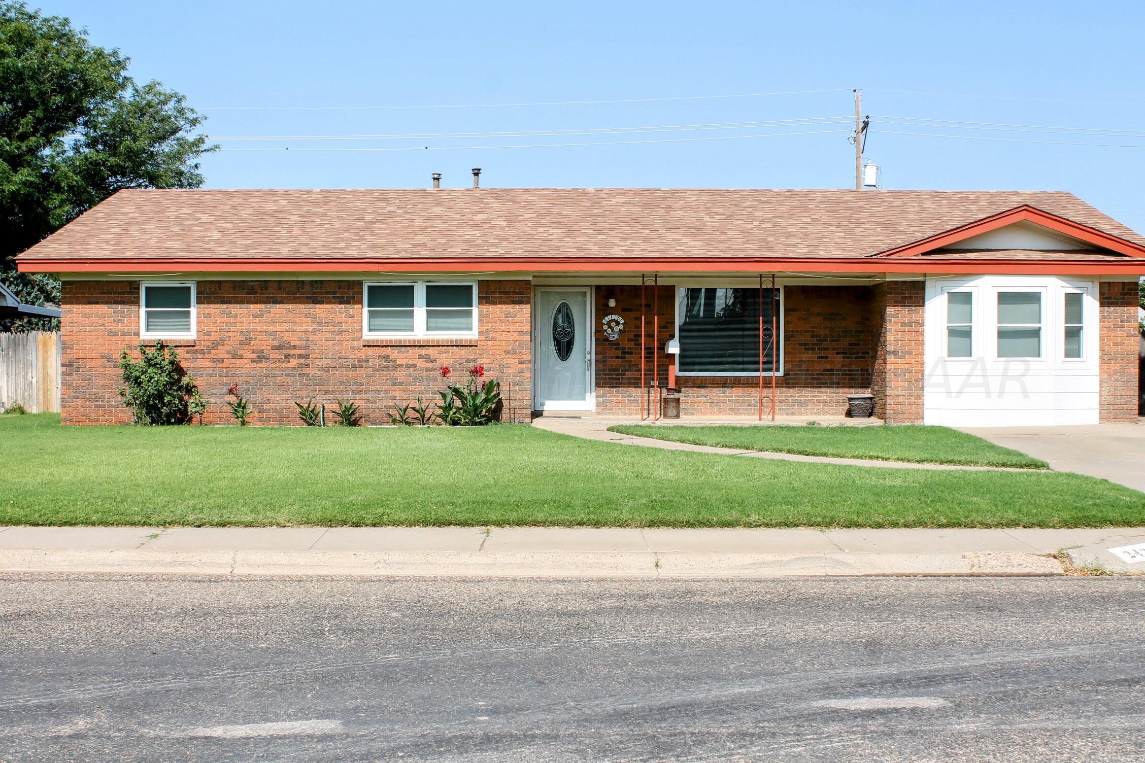 front view of a house with a yard