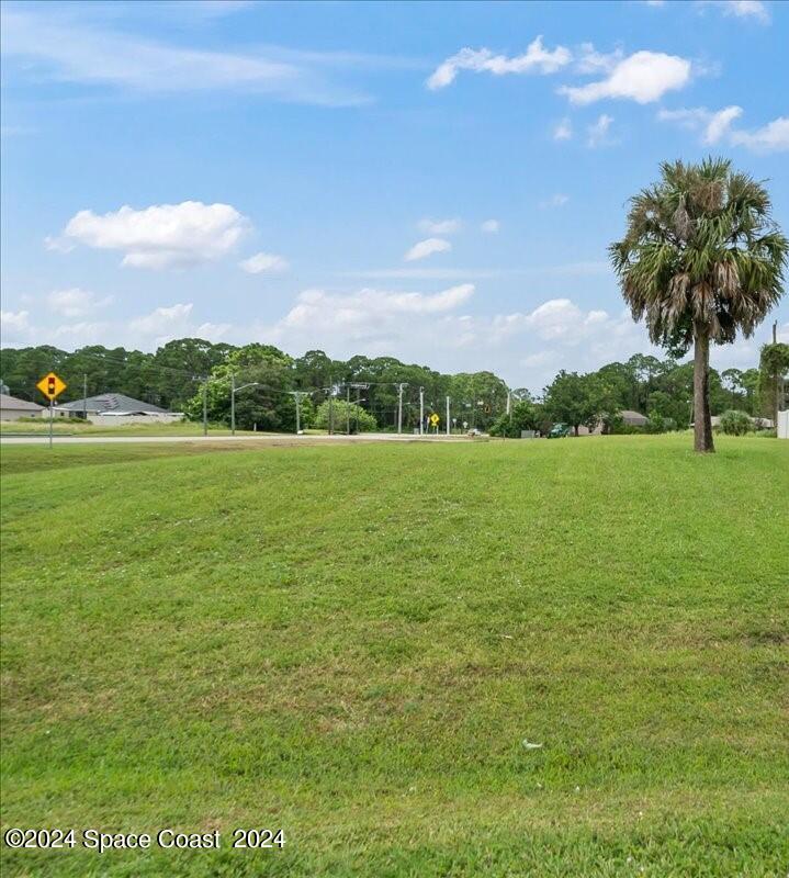 a view of a lake with a yard