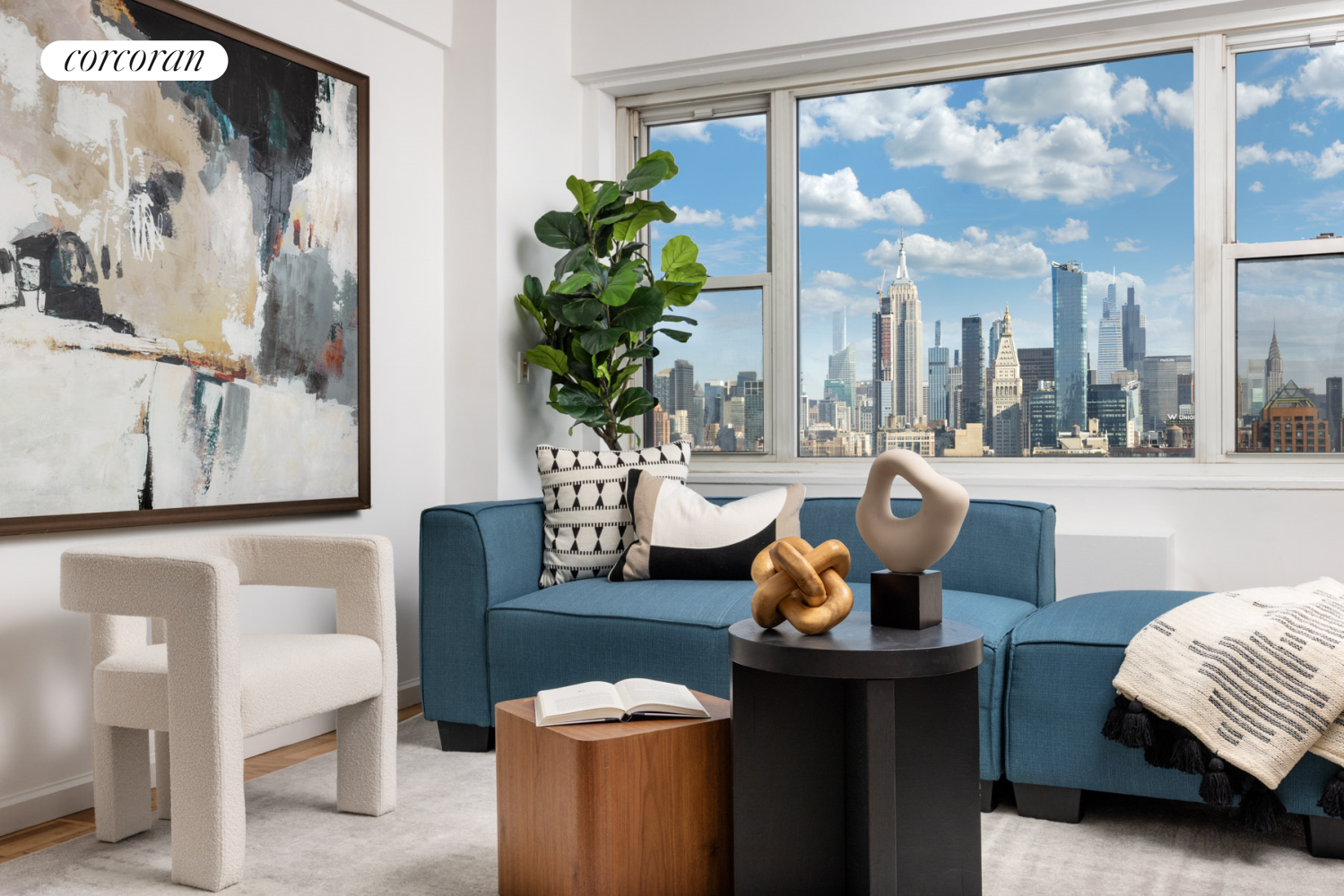 a living room with furniture and a potted plant