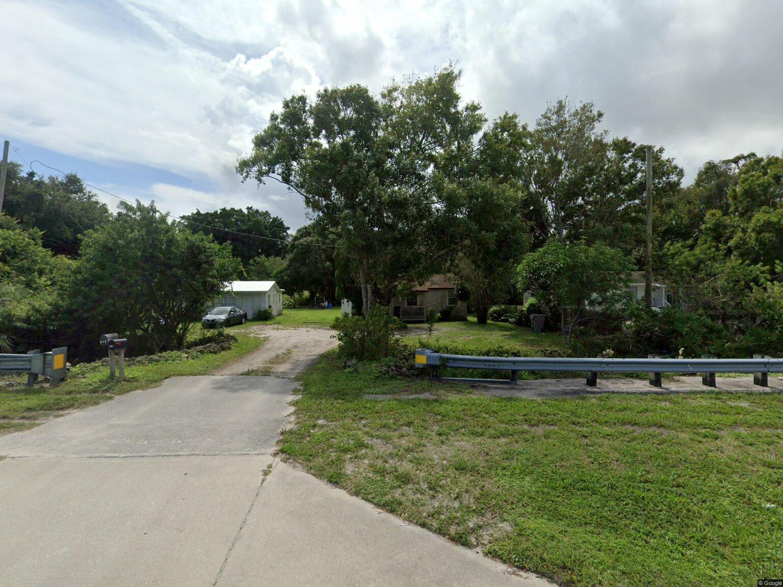 a view of park with plants and trees