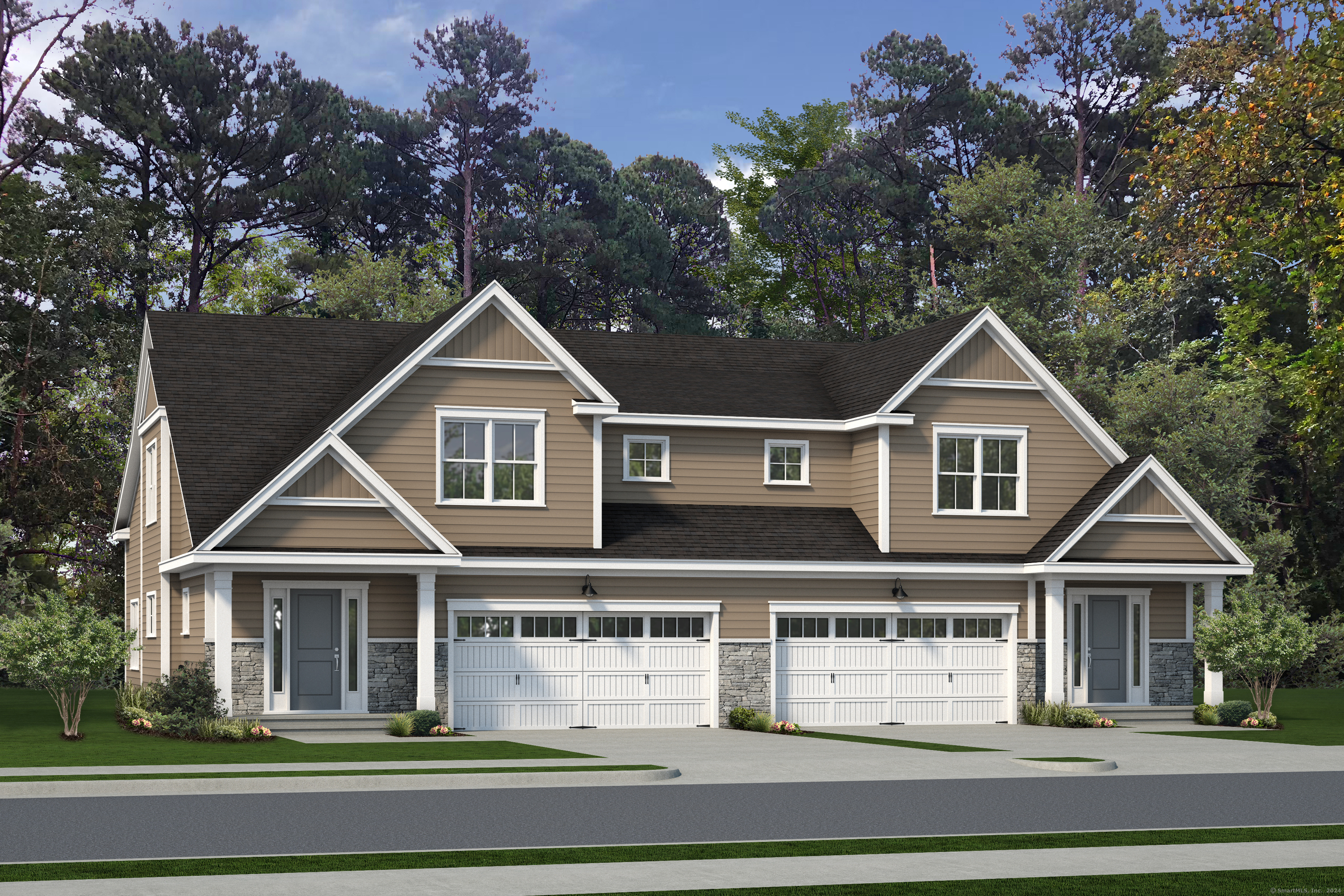 a front view of a house with a yard and trees